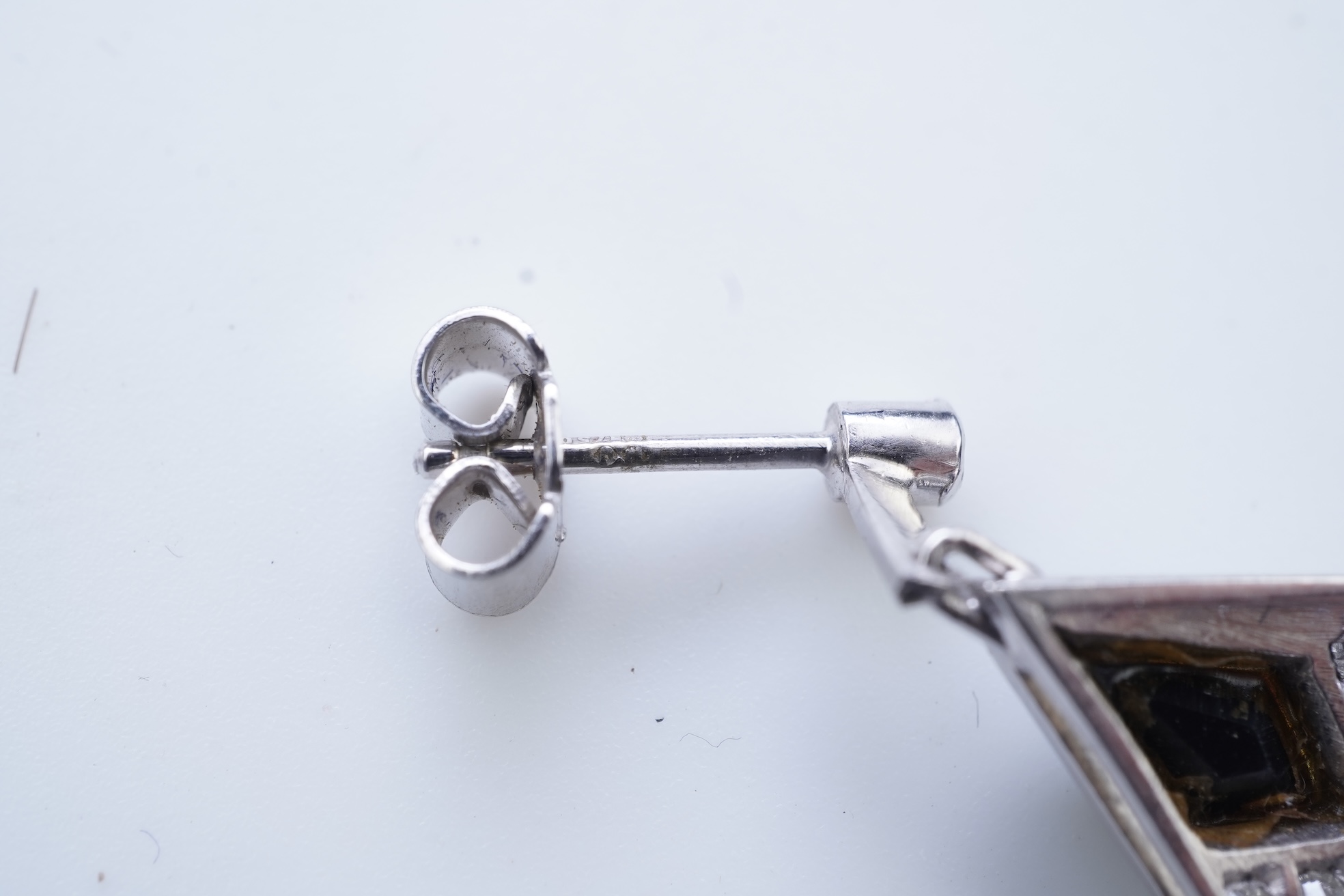 A pair of onyx and diamond earrings